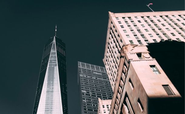 Photo from street level looking up at the tops of buildings